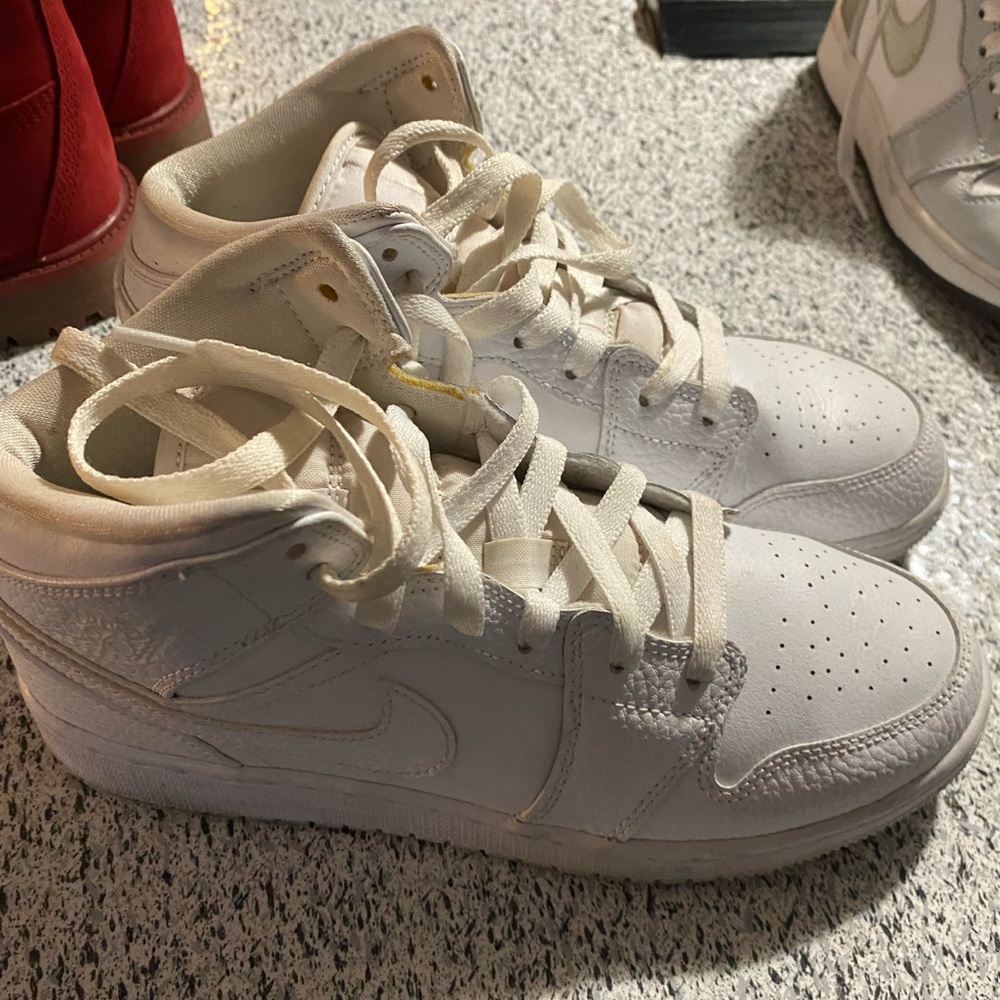 All white Jordan’s 1 mid